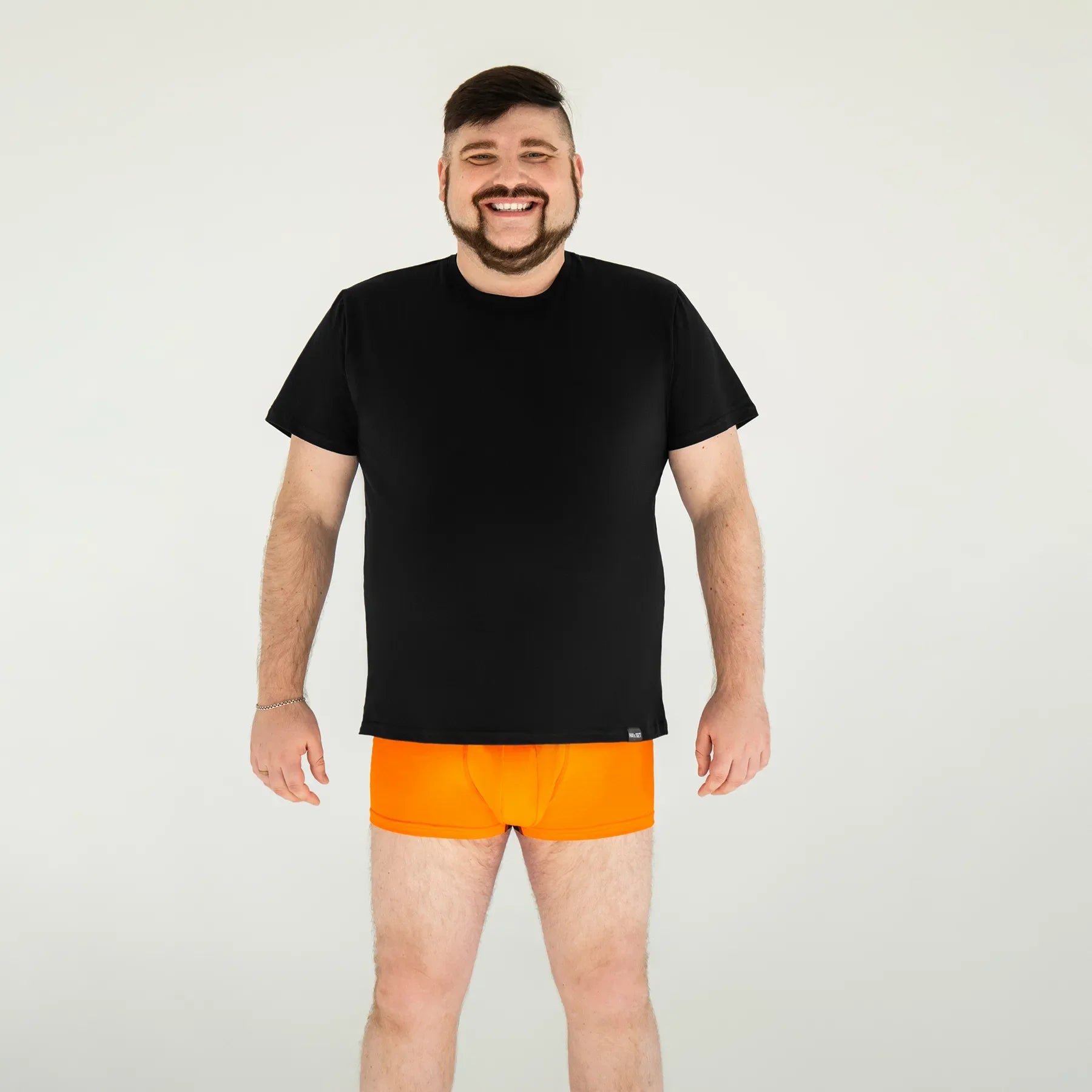 Man’s SET Basic U-neck Plus-Size black cotton T-shirt and orange men’s boxer briefs, front view