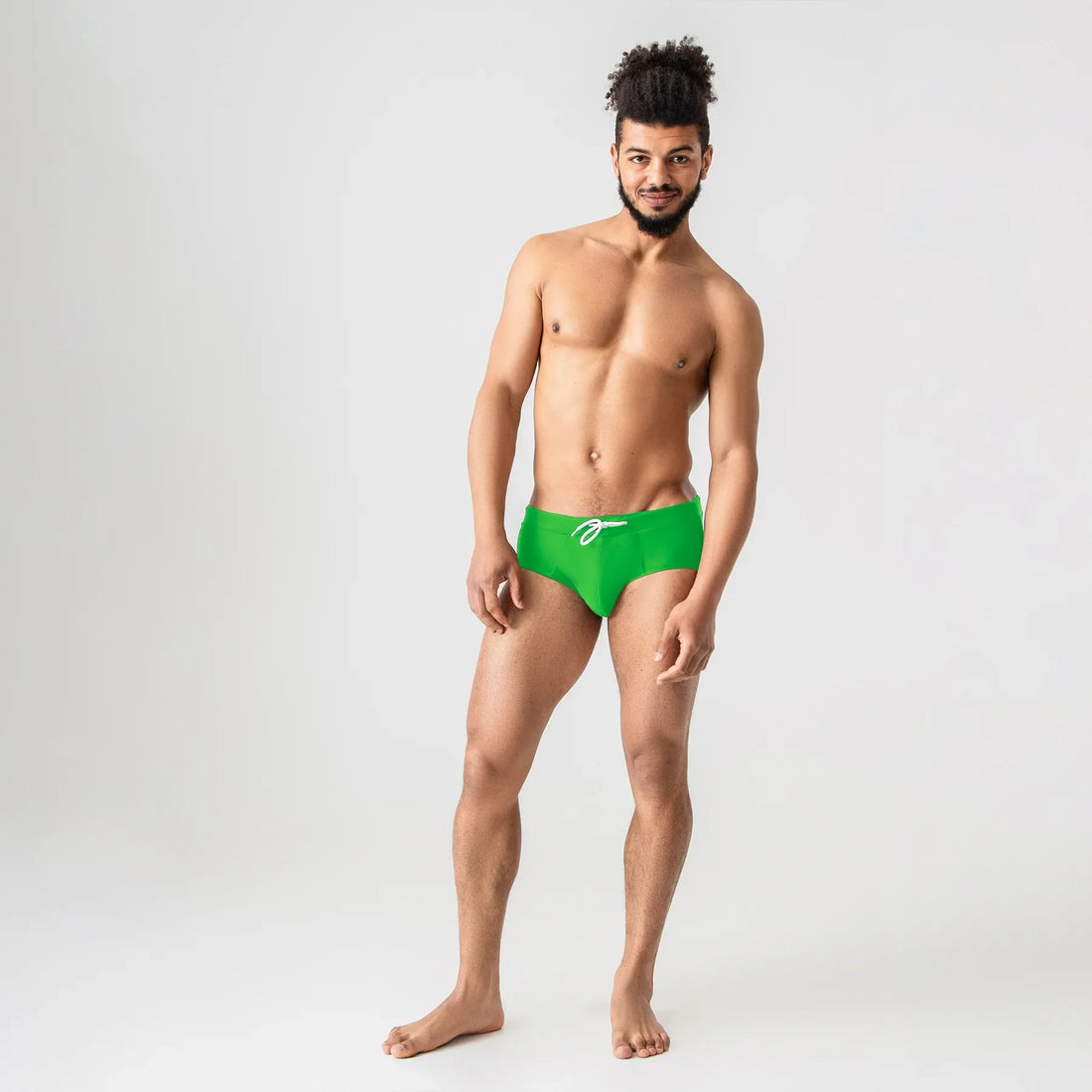 Green anatomical men’s swim briefs by Man’s SET with drawstring waist, front view