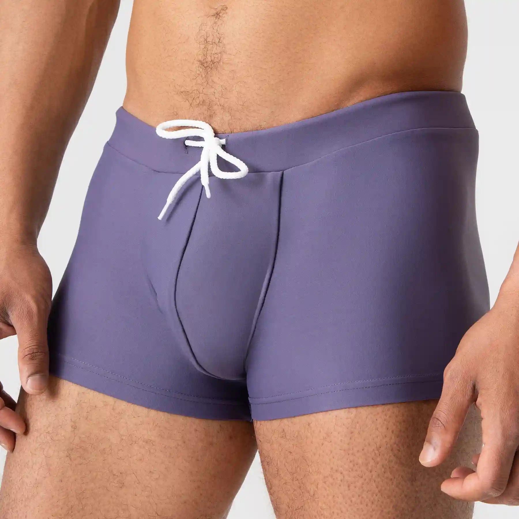 Man’s SET gray and purple anatomical men’s swim trunks with supportive pouch, front view