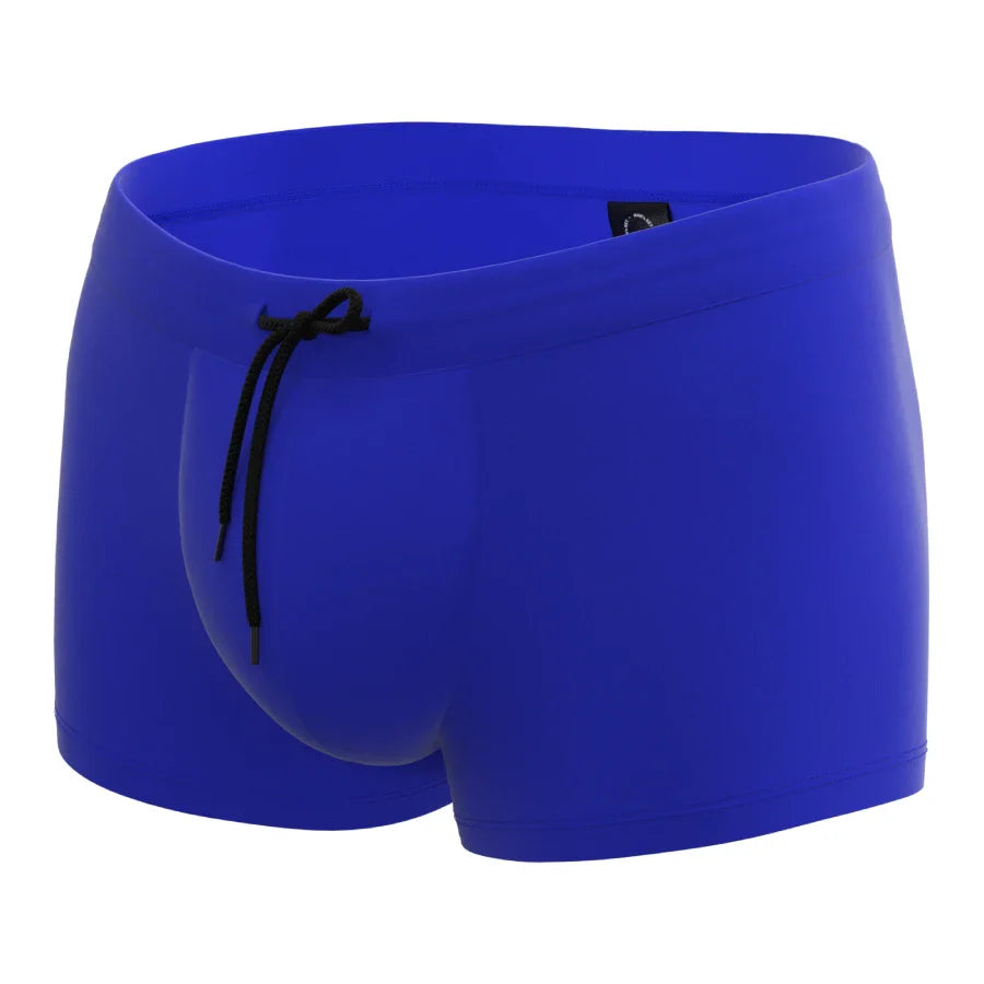 Blue anatomical swim trunks by Man’s SET with ball-support pouch and drawstring waist, front view