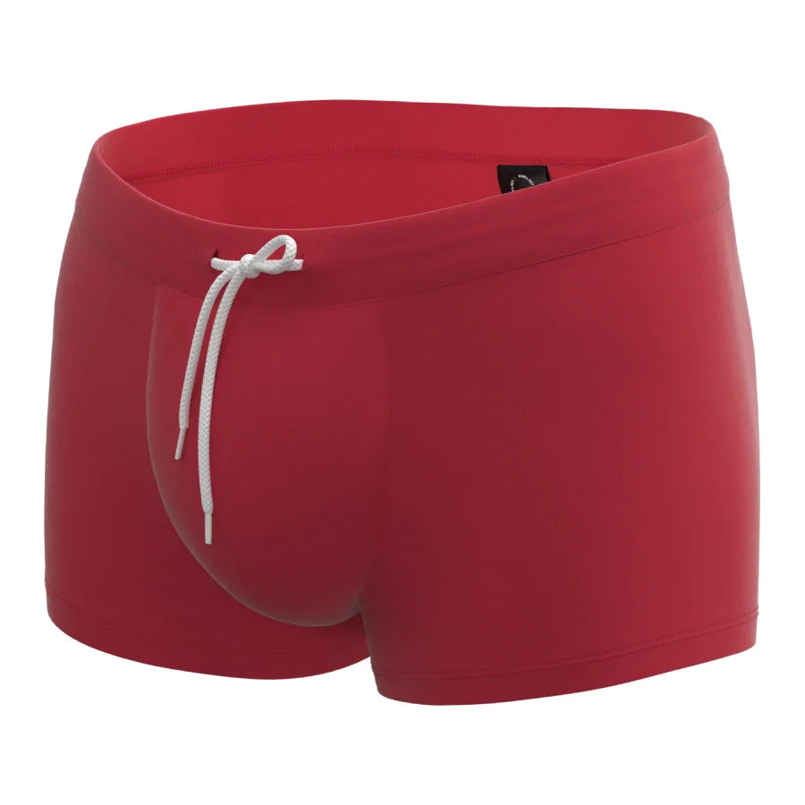 Red anatomical men’s swim trunks by Man’s SET with drawstring waist, breathable pouch, front angled view