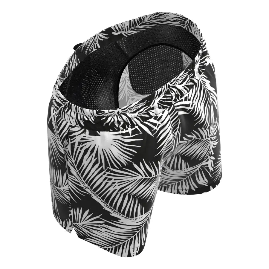 Plus-size men’s black anatomical swim shorts by Man’s SET, white tropical leaf pattern and mesh lining, top-back view